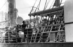 1-Immigrants-at-rail-of-steamship.jpg